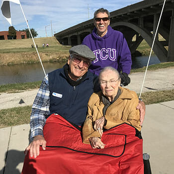 Dr. Whitworth pilots 94-year-old Miss Emma, who has not missed a ride since joining the Cycling Without Age program — she proudly touts her “100% perfect attendance!”