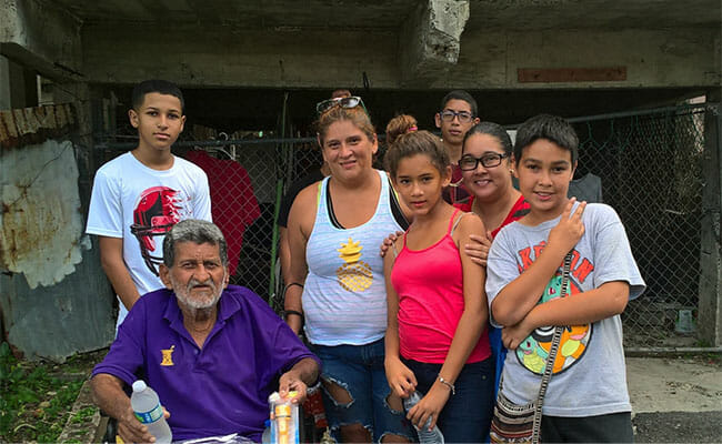 On Family Volunteer Day, the Reyes Torres family joined other local families in bringing food, water and emergency response materials like flashlights to elderly residents of their community in Puerto Rico.