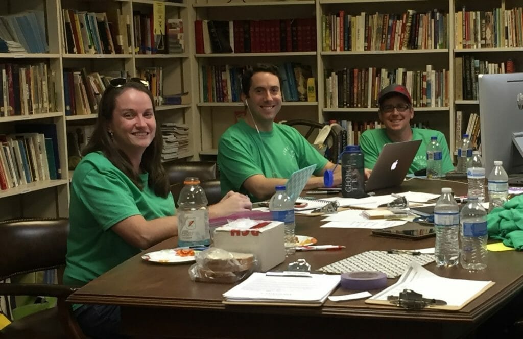 Bryan Grant (center) and other members of Covenant United Methodist’s volunteer team gather to plan hurricane recovery efforts./Courtesy Bryan Grant