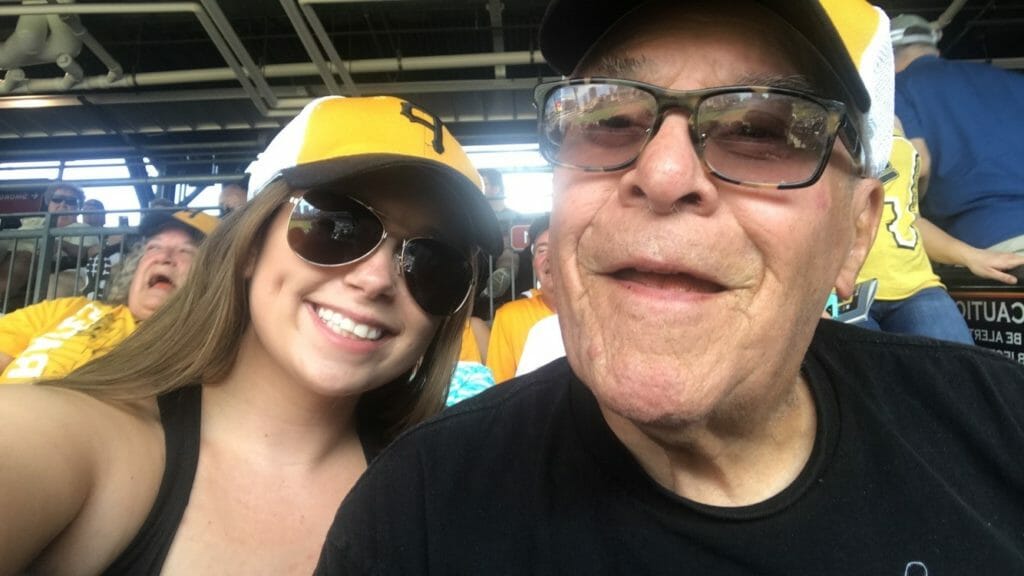 Gina Emricko (left) attending a Pirates game with clients of the Avonmore Center for Active Adults./Courtesy Gina Emricko