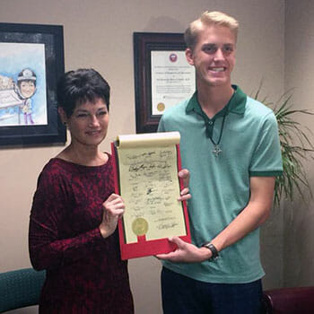 Hunter Beaton with Texas State Senator Donna Campbell in February 2017, when all 31 state senators signed a proclamation supporting the Day 1 Bags initiative for foster kids.