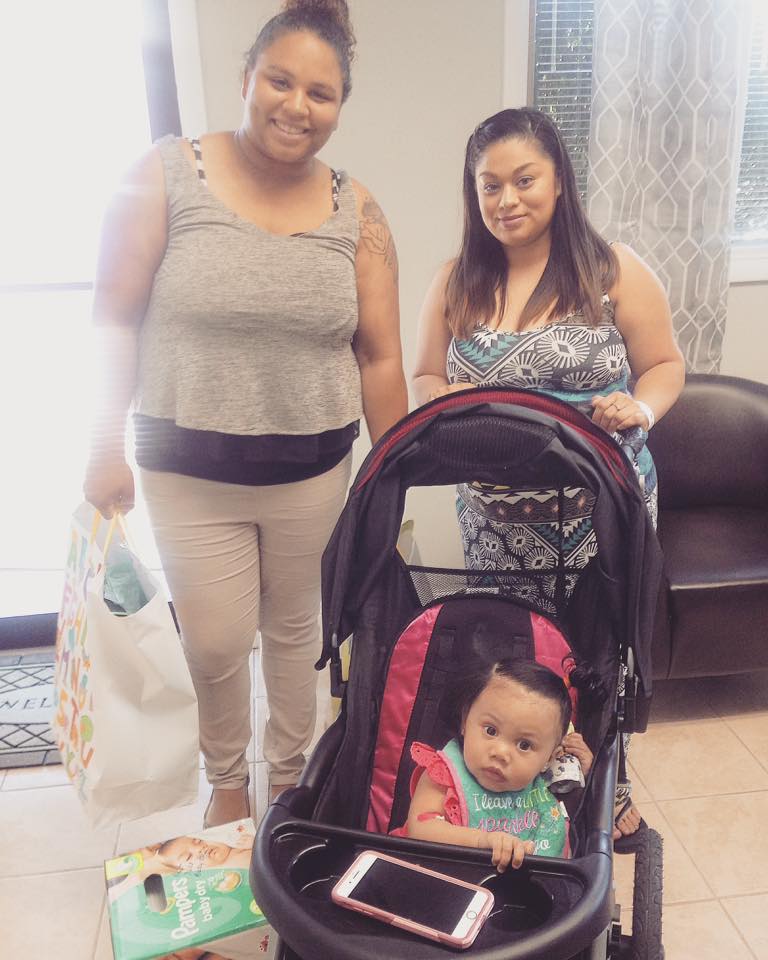 Autumn (left) supplies a client of the Two Percent Project with baby items./Courtesy Autumn Williams
