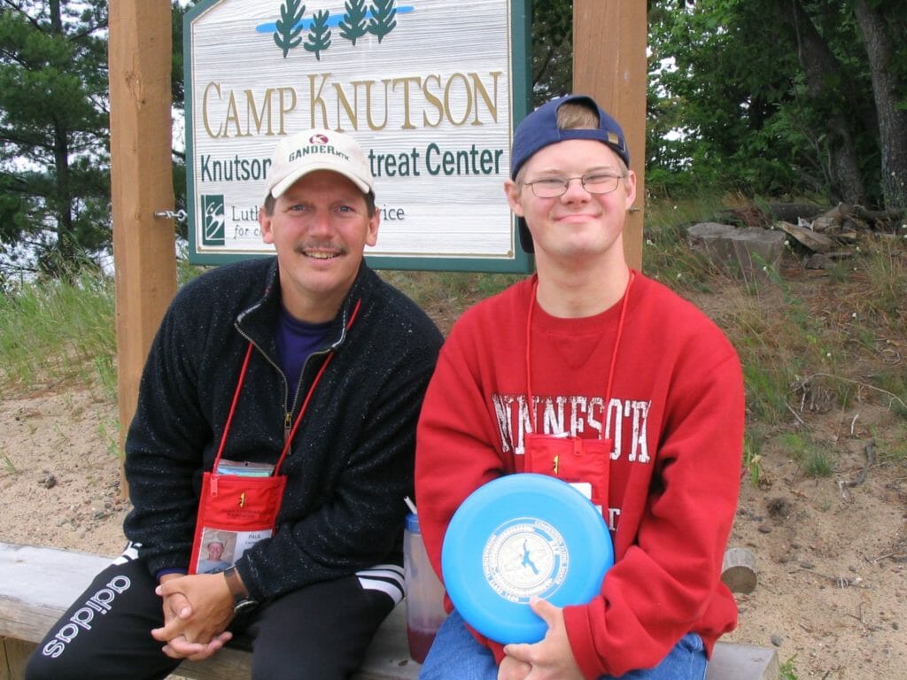 Paul pictured with a camper at Camp Knutson, an organization that serves children and teens with special needs./Courtesy Paul Langenfeld