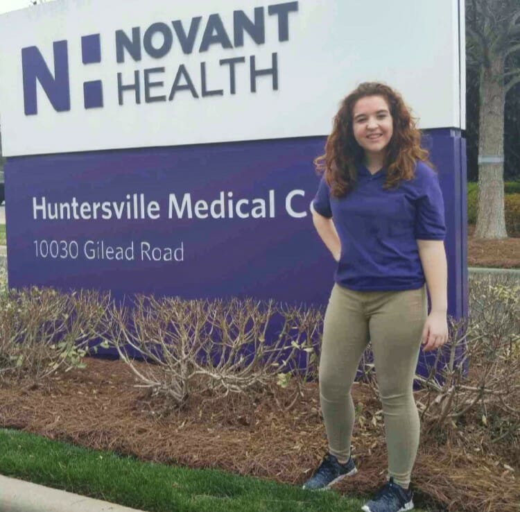 Sophia Pimentel outside of Novant Huntersville Medical Center where she volunteers every weekend./Courtesy Sophia Pimentel