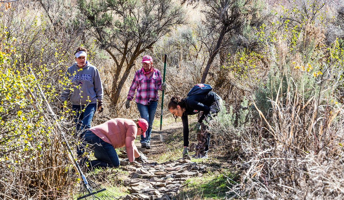 Clif Bar employees in Twin Falls, Idaho, rebuilding trails and picking up trash during the Companywide Service Day at Centennial Park.