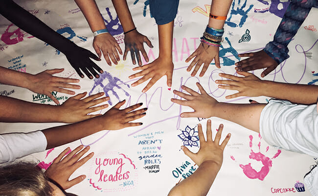 Girls take part in a hands-on activity at a Like A Girl LPS social.