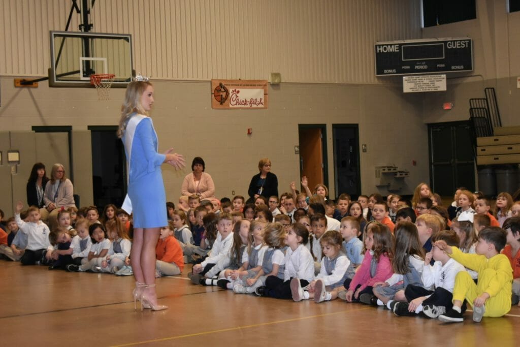 Kayla enjoys taking her education programs to as many schools as she can. She is pictured here with the students of St. Theresa of Calcutta, speaking about “Think First, Be Kind.”/Courtesy Kayla Repasky
