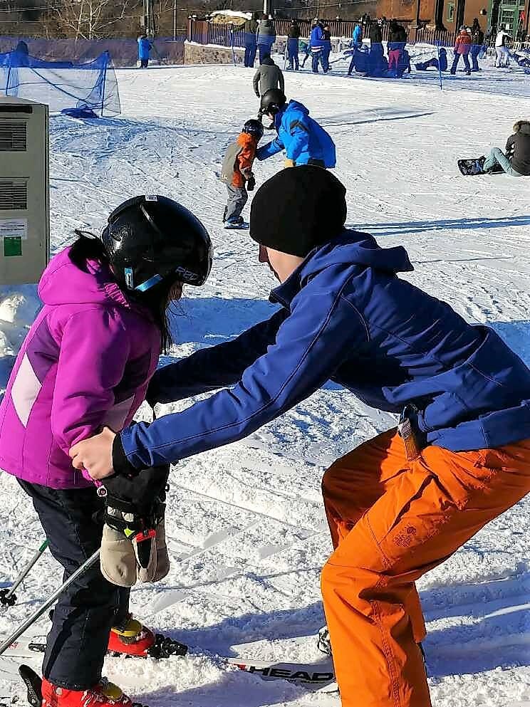 Cory Gorczycki teaches a child from Mi Casa Es Puebla how to snowplow at Mountain Creek./Courtesy Cory Gorczycki