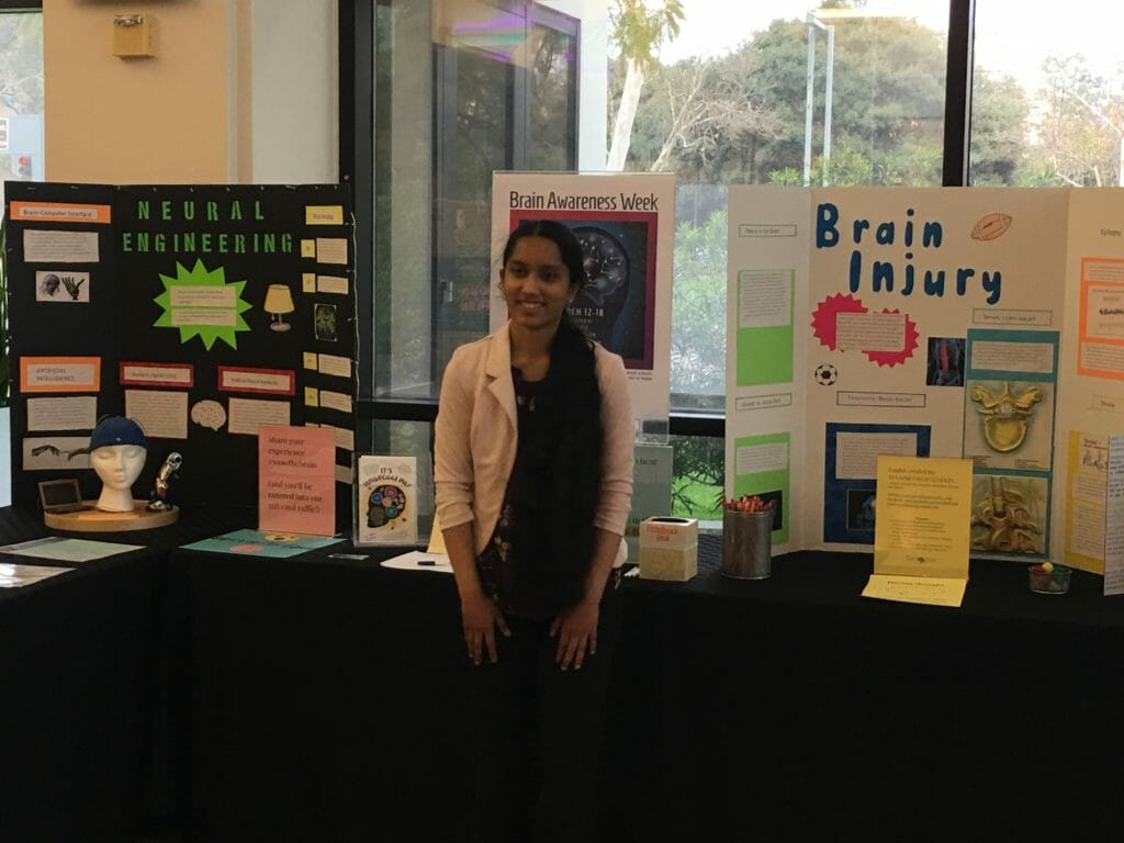 Karishma is all smiles after creating a neuroscience exhibit in celebration of Brain Awareness Week./Courtesy Karishma Muthukumar