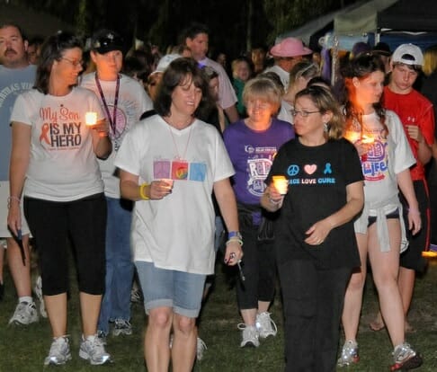 Maryanne Bolduc (3rd from left, pictured in baseball hat) and her sister Sue Taskey (4th from right, pictured in purple shirt) at the Relay for Life 2010./Courtesy Maryanne Bolduc