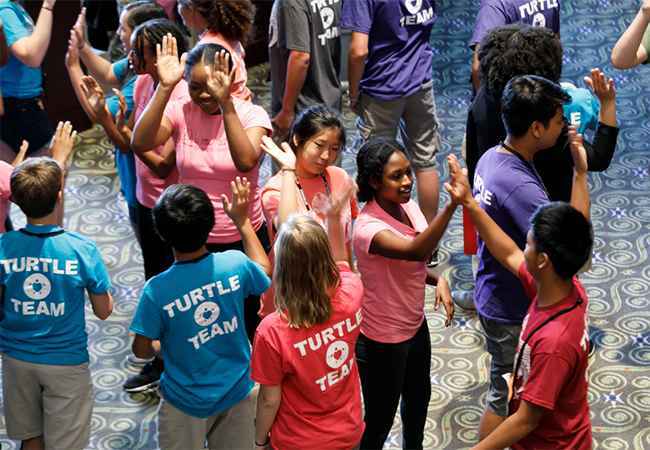 Team members from Love a Sea Turtle and Diamond in The Rough participate in a workshop at the Youth Summit.