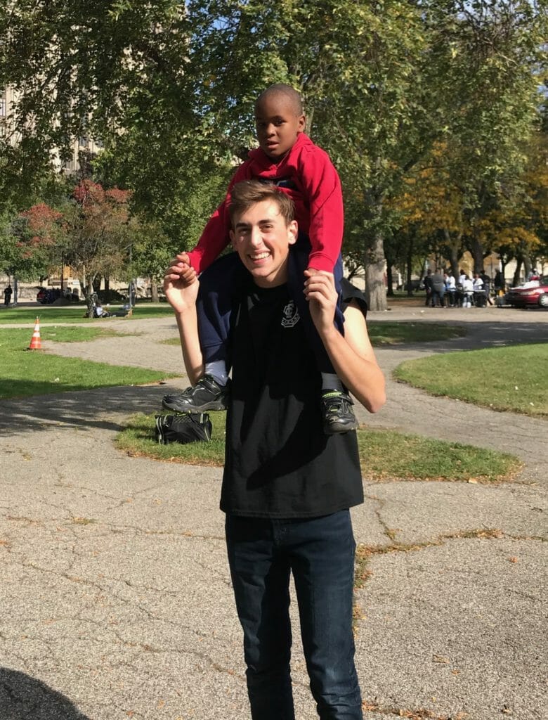 Quinn Favret giving his friend Davion a shoulder ride./Courtesy Quinn Favret