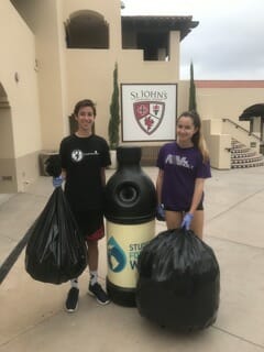 Grace Dennis and her brother managing bags of aluminum and plastic materials emptied and sorted from the many campus wide recycling bins./Courtesy Grace Dennis