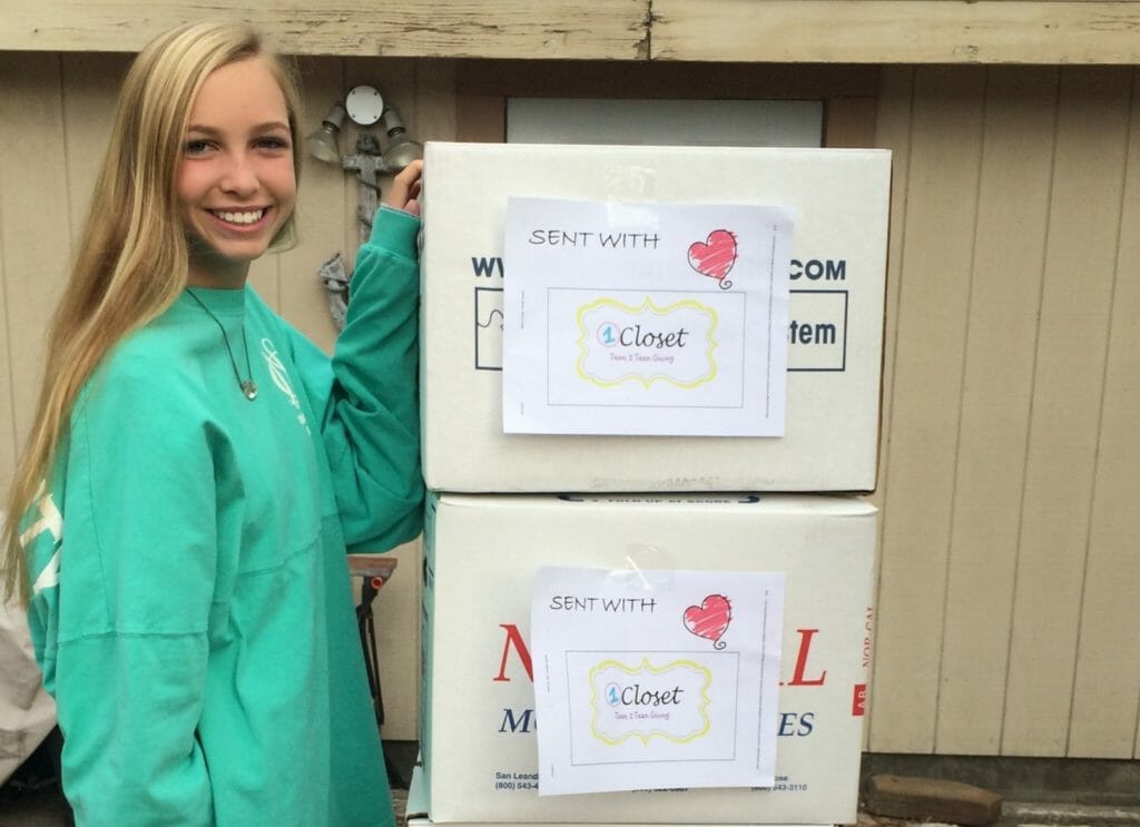 Carly Glasson with some of the clothing donations from 1Closet./ Courtesy Carly Glasson