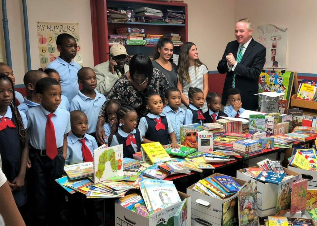 Hempstead Town Receiver of Taxes Don Clavin and Senior Councilwoman Dorothy Goosby join Eden Schneck and volunteer Alexandra Zarka as they donate over 2,000 books to Pat-Kam School & Early Childhood Center in Uniondale, N.Y.  They were joined by Ronald and Geraldine Clahar of Pat-Kam School & Early Childhood Center./ Courtesy Eden Schneck