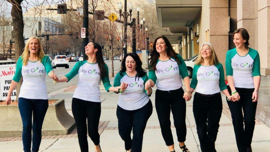 Katie (left) pictured alongside some members of the C.A.R.E. Team: Lauren, Lisa, Melinda, Judith, Cait. The team is a group of patients and former caregivers who spread awareness, advocacy, research, and education to clinicians, researchers, patients and caregivers for a cure./ Courtesy Katie Glenn