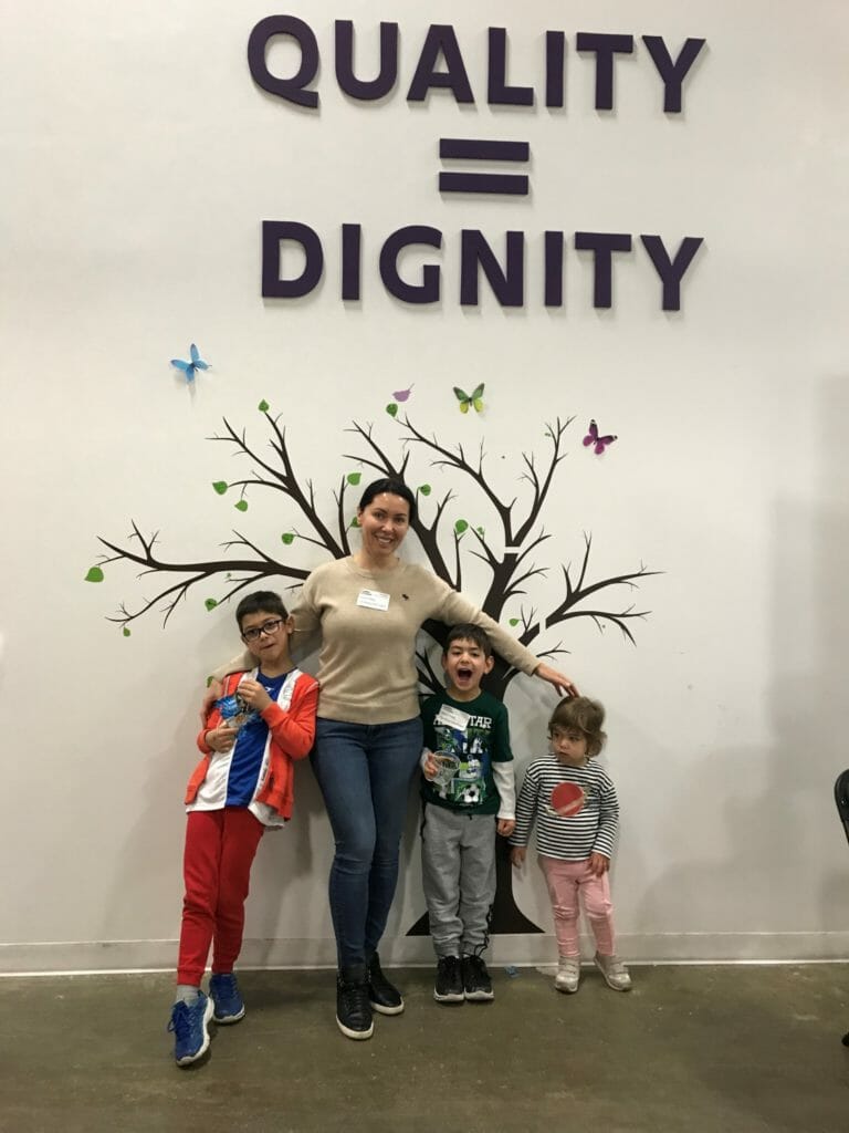 Tayna, Peter, Simon and Anabelle sorting clothes at Cradles to Crayons, where donations are accepted for disadvantaged children in Chicago.