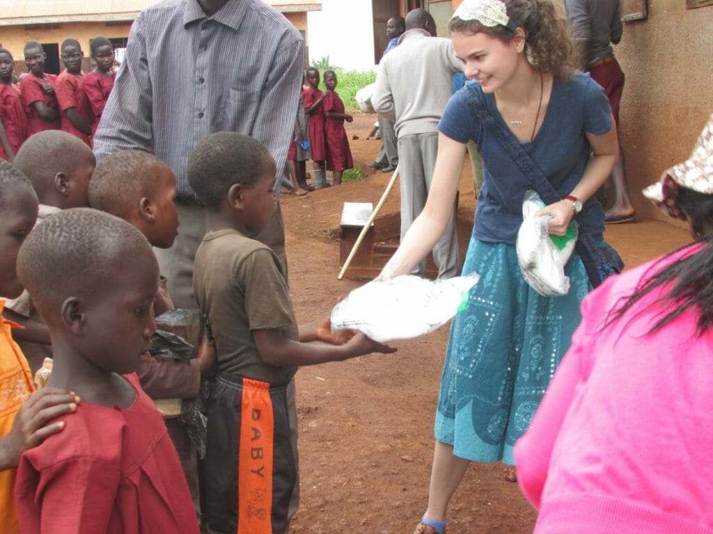 Mary Claire McGlynn distributing nets when she visited the village in 2016./ Courtesy Mary Claire McGlynn