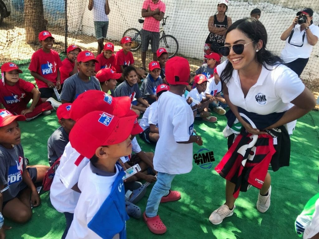 Nicole Fernandez takes baseball equipment to a team called PDF in Camp de la Cruz, Atlantico, Colombia, in February 2018.  Some of the children are recent migrants from Venezuela./Courtesy Nicole Fernandez