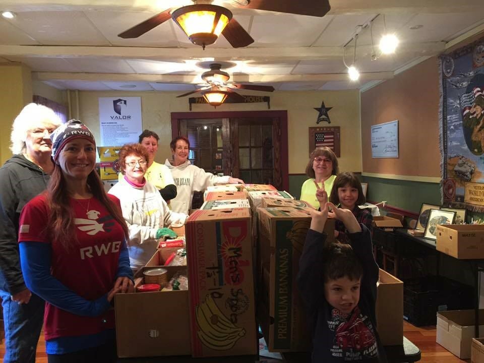 Sandy Spotts (3rd from right) working in the pantry at Paul’s House./ Courtesy Sandy Spotts