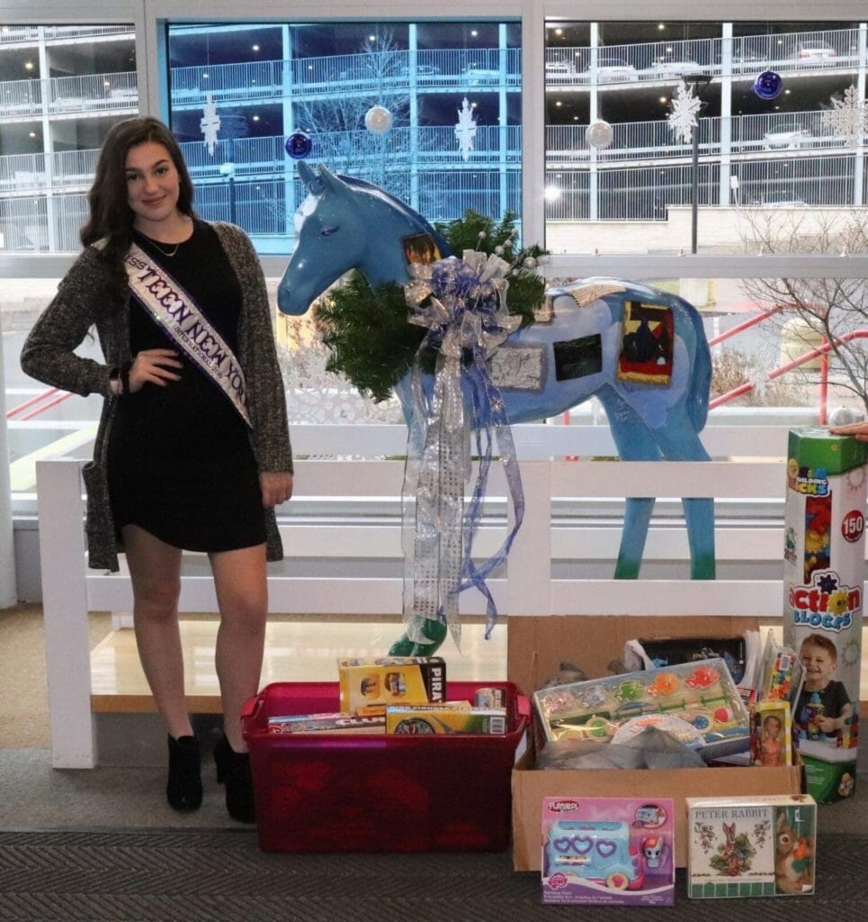 Arlena Occhipinti with collected toys from her annual toy drive benefiting Children's Miracle Network./Courtesy Arlena Occhipinti