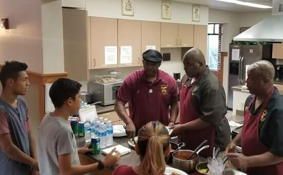 Curtis (center) along with other volunteers serving families dinner at the El Paso Ronald McDonald House./Courtesy Curtis Smith 