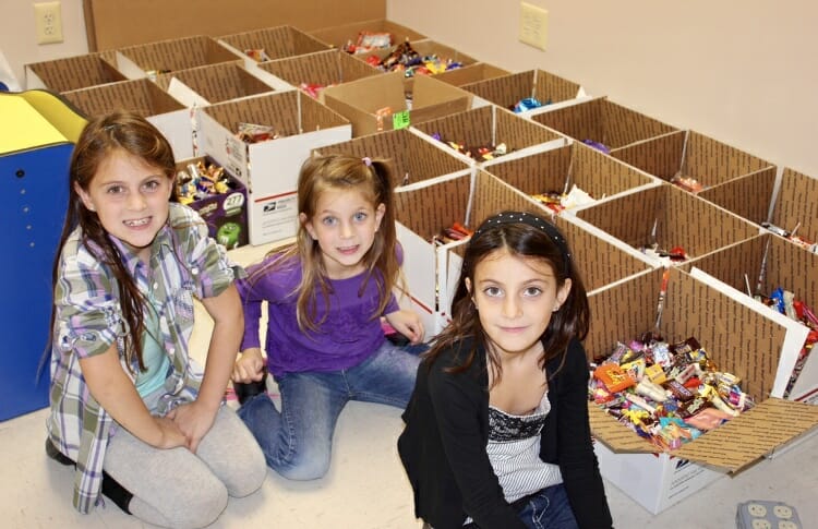 The DiFabio sisters have collected over 1,200 pounds of Halloween candy for Operation Gratitude , an organization that puts together care packages for US Troops./ Courtesy Alicia DiFabio