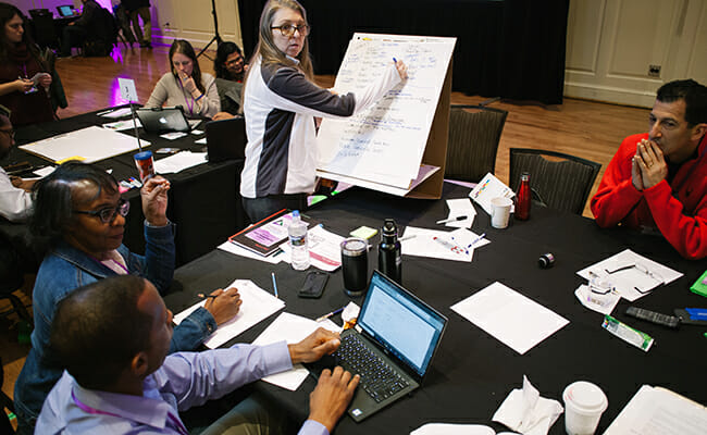 Nonprofit leaders gather to learn from project management volunteers during the Project Management Day of Service. 