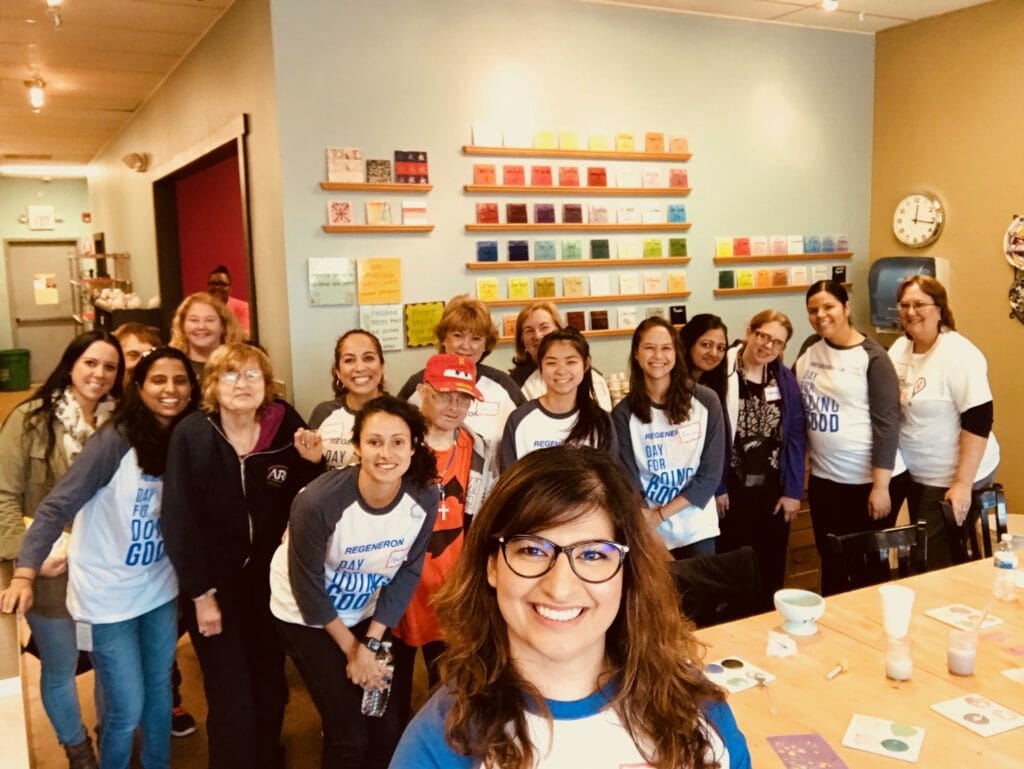 Sahar Rizvi works at Regeneron, pictured here for their Day for Doing Good 2017 where volunteers painted pottery and socialized with the Arc of Rockland Adult Day Program group./ Courtesy Sahar Rizvi