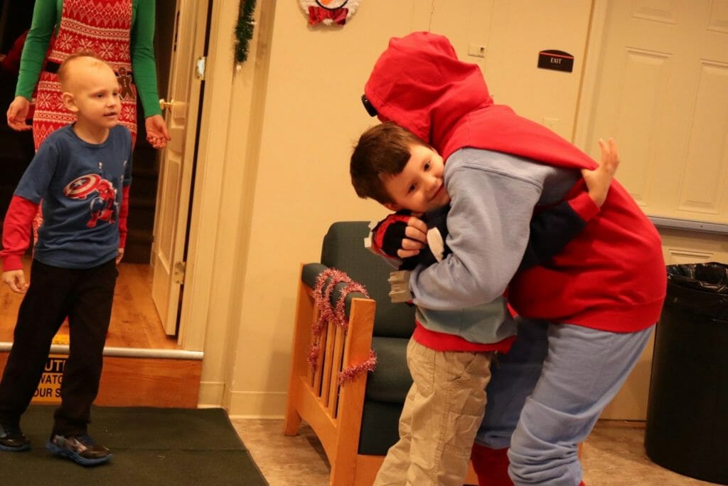 Kaeden (far right, dressed as Spider Man) visits hospitalized children./Courtesy Kaeden James Rhodes