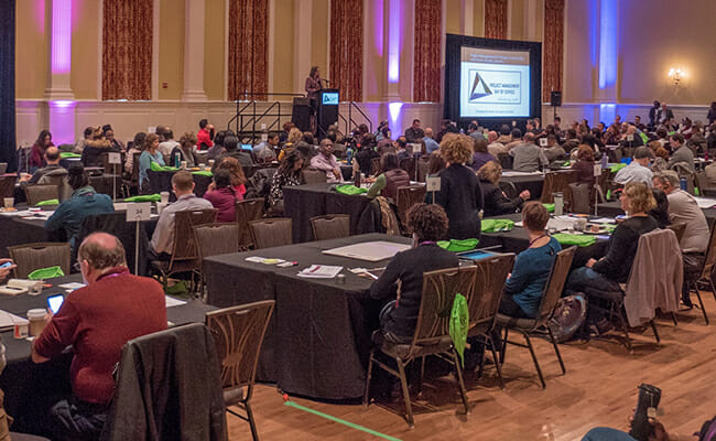 Nonprofit leaders gather together to learn from project management volunteers during the Project Management Day of Service.