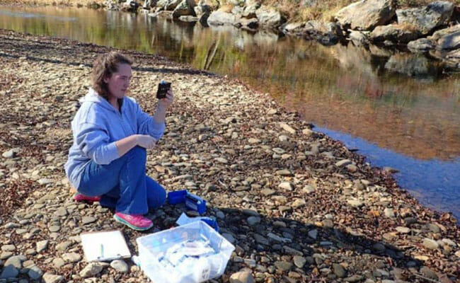 Brittaney Dyer collects data from a stream she adopted in Blairsville, Georgia, helping to monitor the quality of the water that flows into the Hiawassee River.