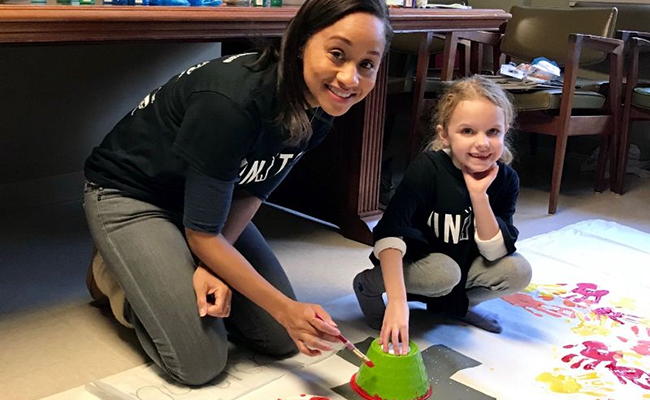 Volunteers craft encouraging messages for public school teachers with Hands On Atlanta. 