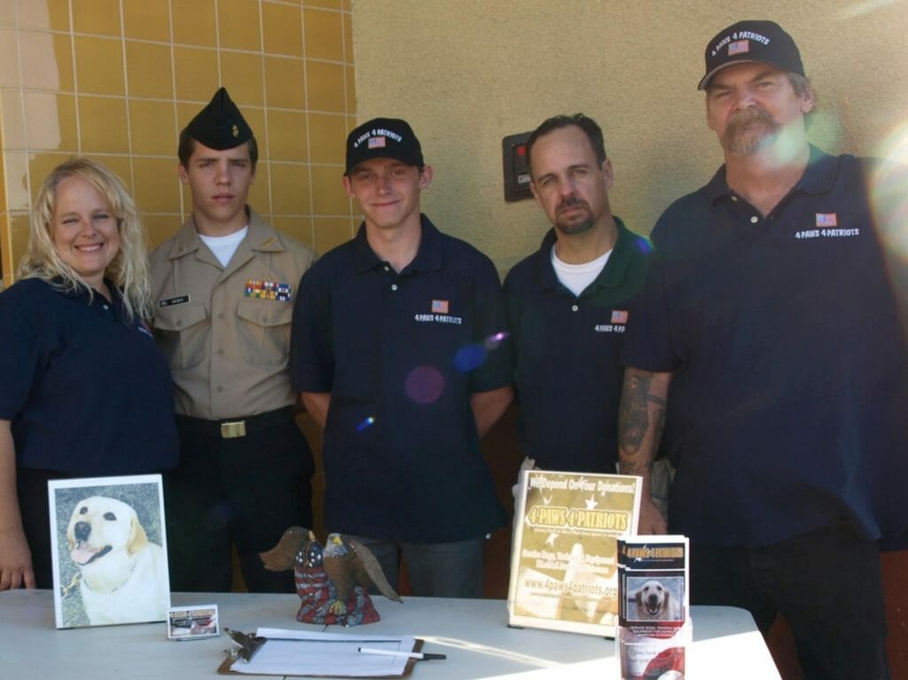 Tim LeBlanc (far right) and some of his team 4 Paws 4 Patriots team members./ Courtesy Tim LeBlanc