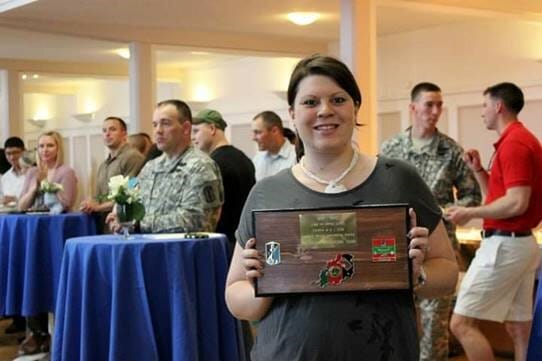 Michelle Merson receiving an appreciation award for assisting spouses of deployed soldiers./Courtesy John Merson