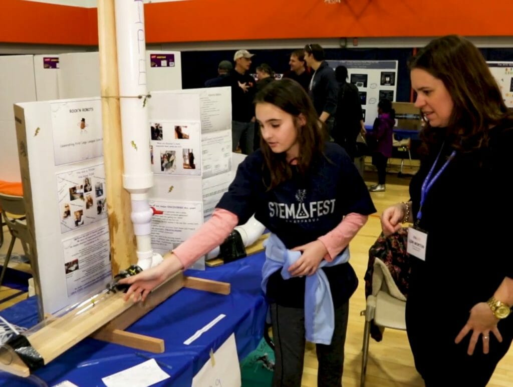 Lori Morton with a young inventor at Chappaqua STEM Fest./ Courtesy Lori Morton