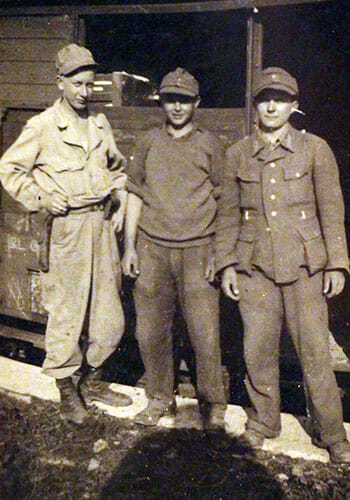 Gene Neeley (left) with German boys during World War II.