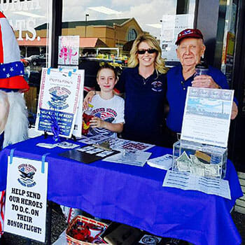 Gene Neeley and Phyllis Piraino raise money to send more veterans on their honor flight.