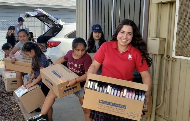 Isabella Tejeda pictured delivering 500 new Accelerator Reading (AR) books to start the Higher Ground Library./Courtesy Isabella Tejeda