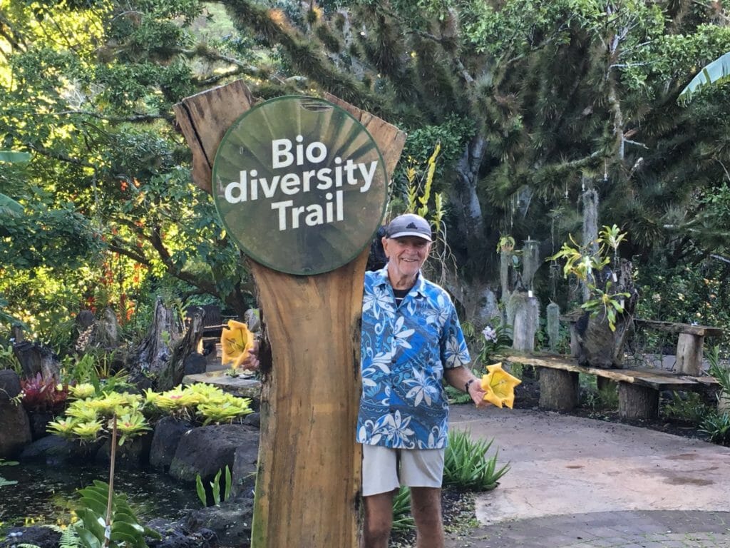 Loren Johnson in his volunteer “office” at the National Tropical Botanical Garden. Loren Johnson walks two miles a day cleaning signs along the trails of the garden./ Courtesy Loren Johnson