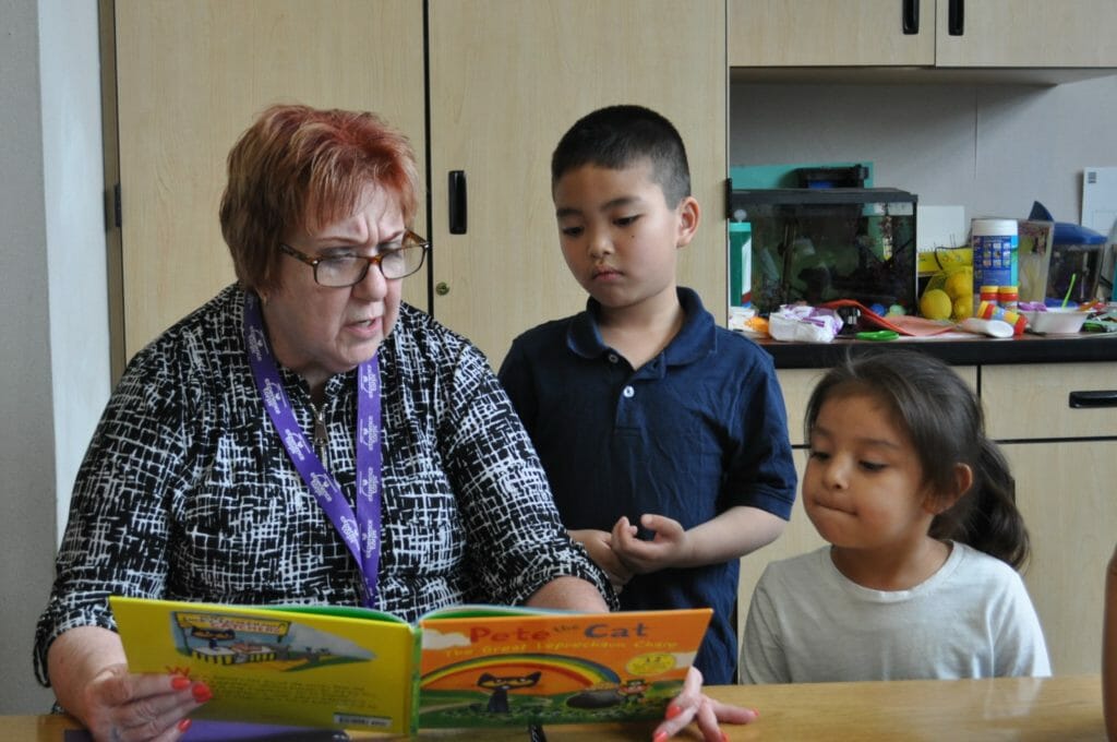 California Woman is “Grandmother” to Kindergarteners Developing Reading