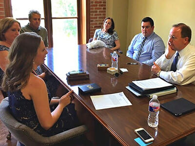 Emily Kate speaking with Congressman Bill Flores (TX-17) about educational programs she worked with at her local library and university, as well as voter registration and election bias issues./Courtesy Emily Kate Mosley