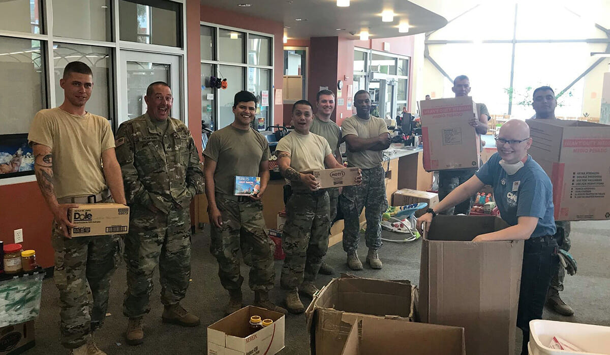 National Guard members from Travis Air Force Base visit the American Canyon shelter to help sort donations.