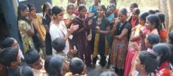 Tanvi Jain Patyal (in white) meets with a group during her work with her nonprofit, Parivartan.