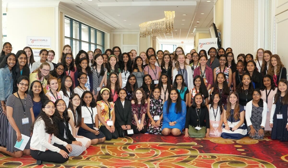 Large group of girls and women posing.