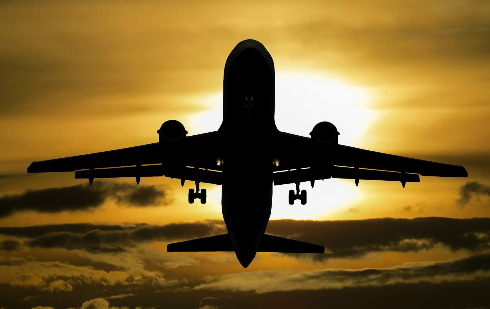 silhouette of front of airplane in flight