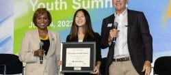 Michelle Song receives Daily Point of Light Award from Points of Light President and CEO Natalye Paquin and Board Chair Neil Bush