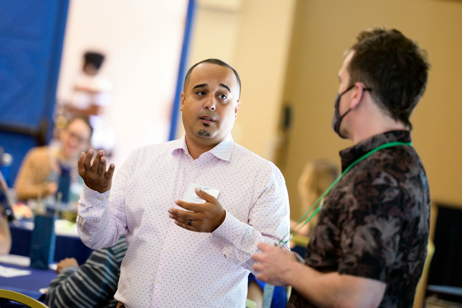 Image of two men talking