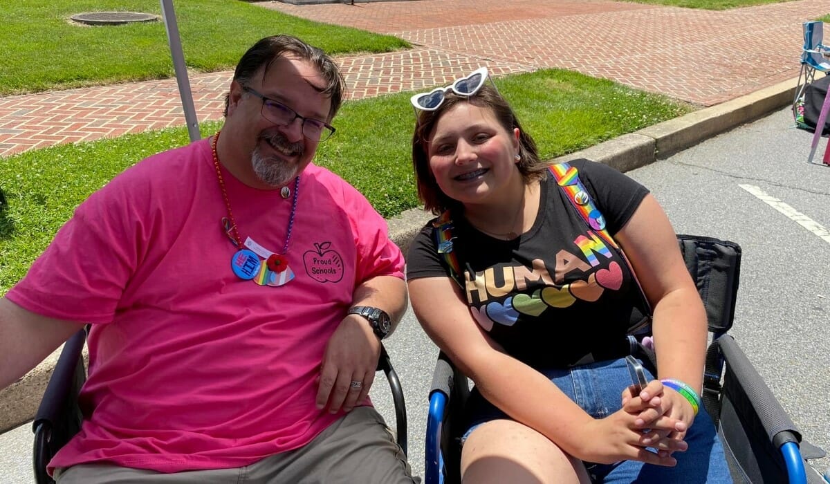 Two people seated in chairs