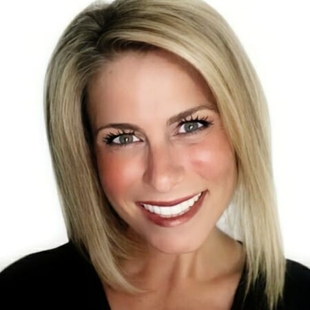 Headshot of a blonde woman in a black top.